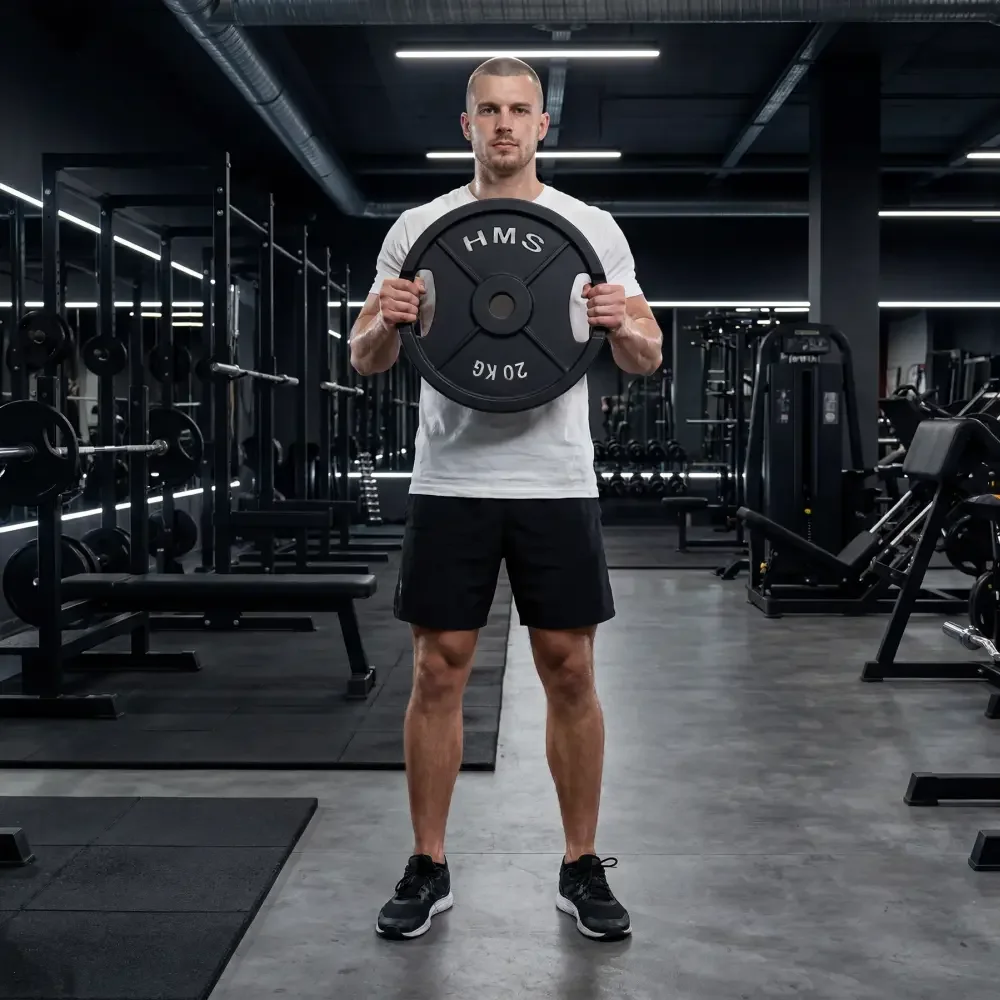 Sportaš s HMS utezima u teretani Sportaš s HMS utezima u teretani